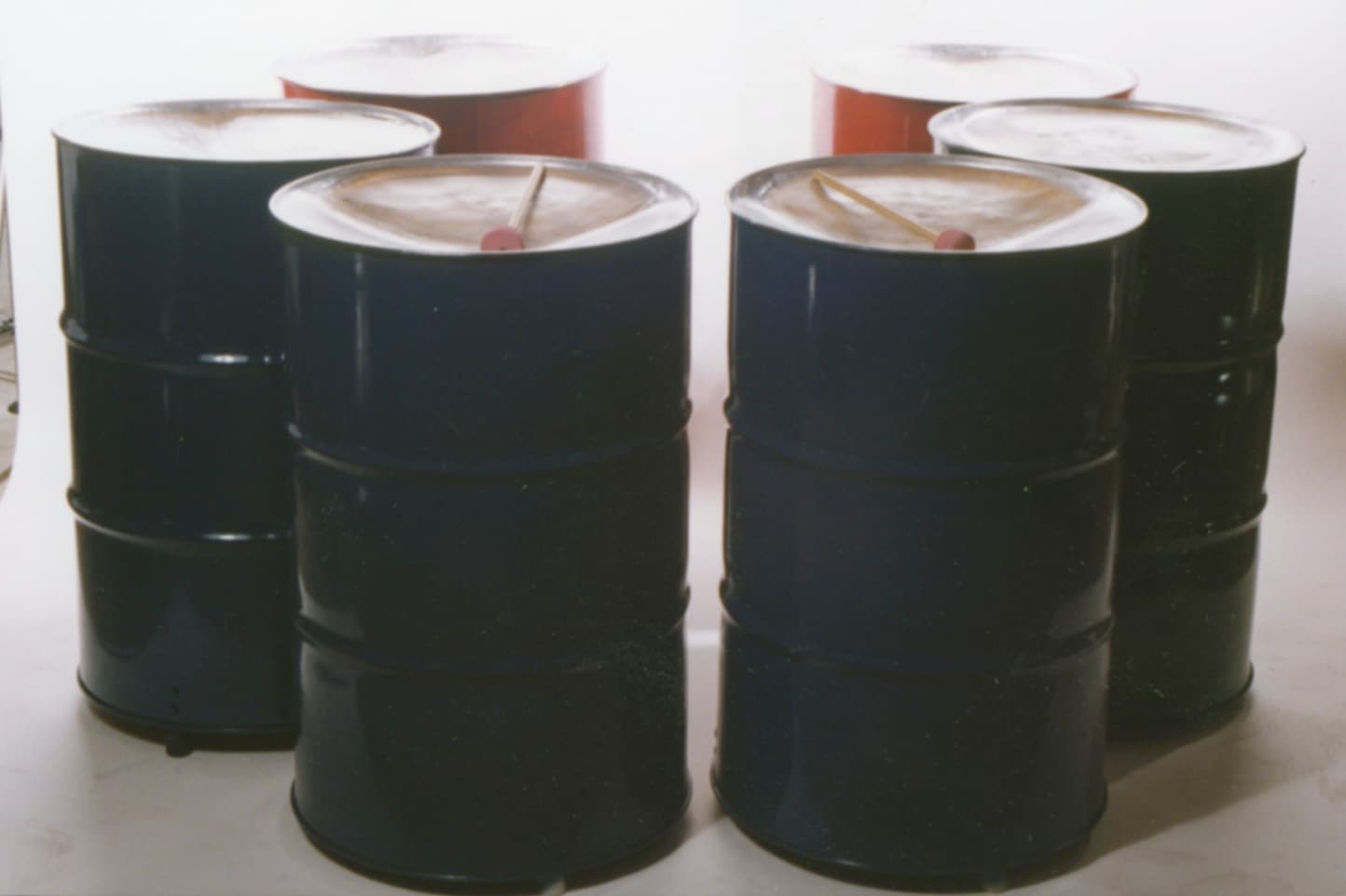 Full-size bass steel drums in barrels, ready for shaping and tuning